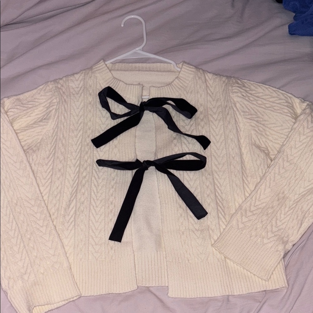 Cream Sweater with Black Bow Accents